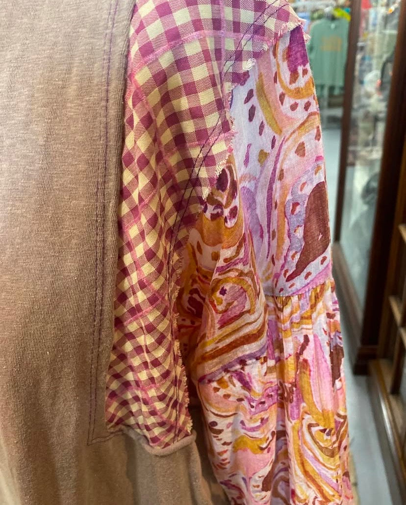 Close up detail of mixed pattern sleeve on cotton mineral wash top.