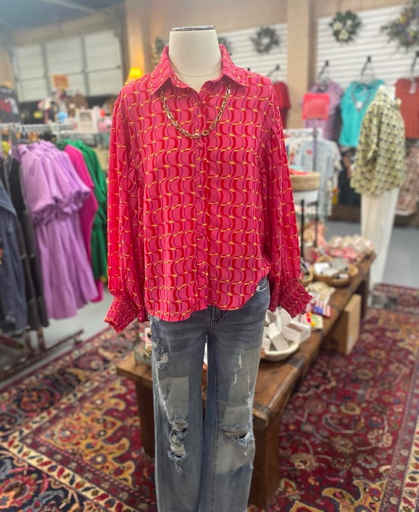 long sleeve red and pink swirl top with balloon sleeves and button front