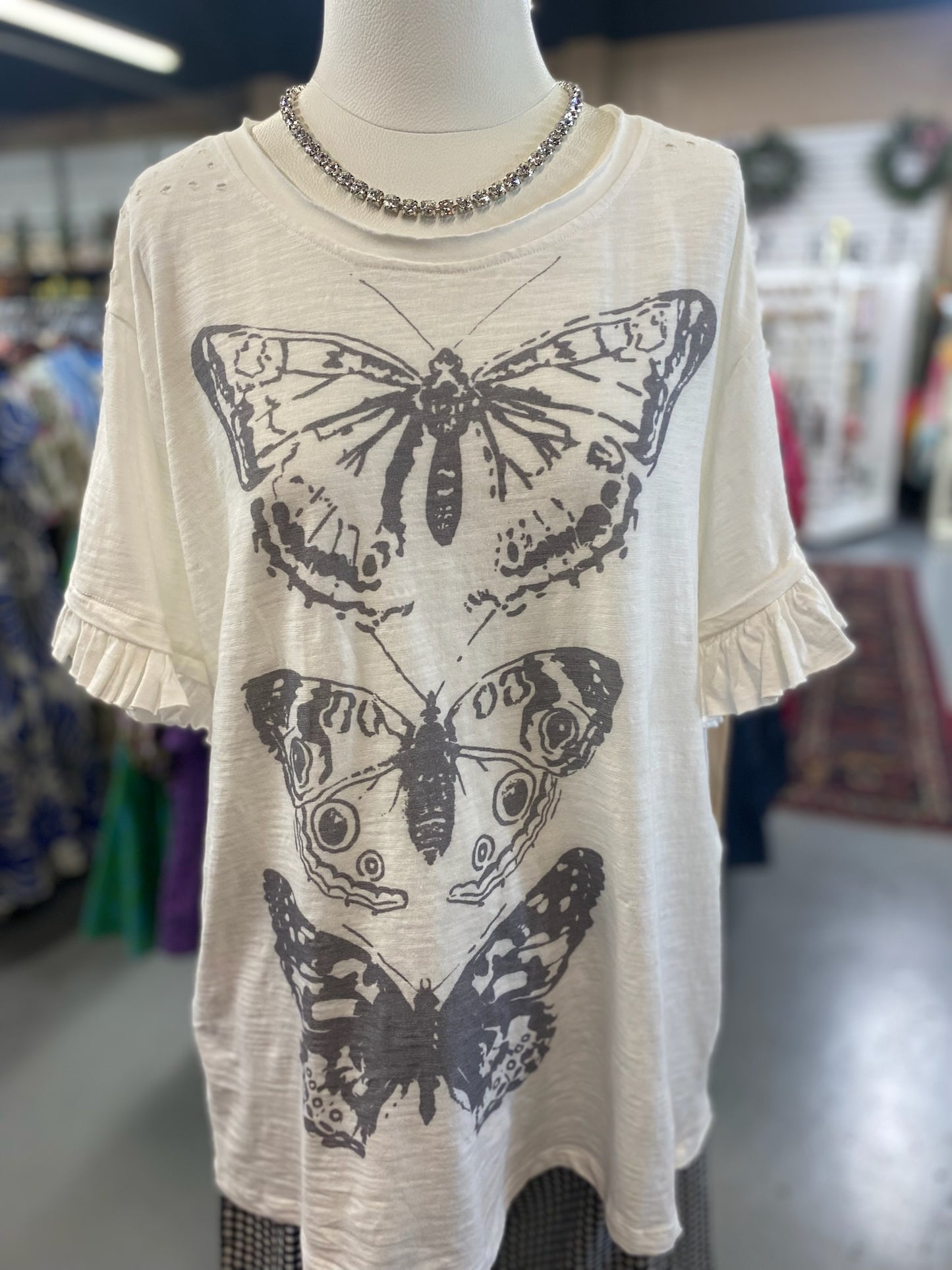 Ruffle Butterfly Top with distressing on the shoulders and pockets