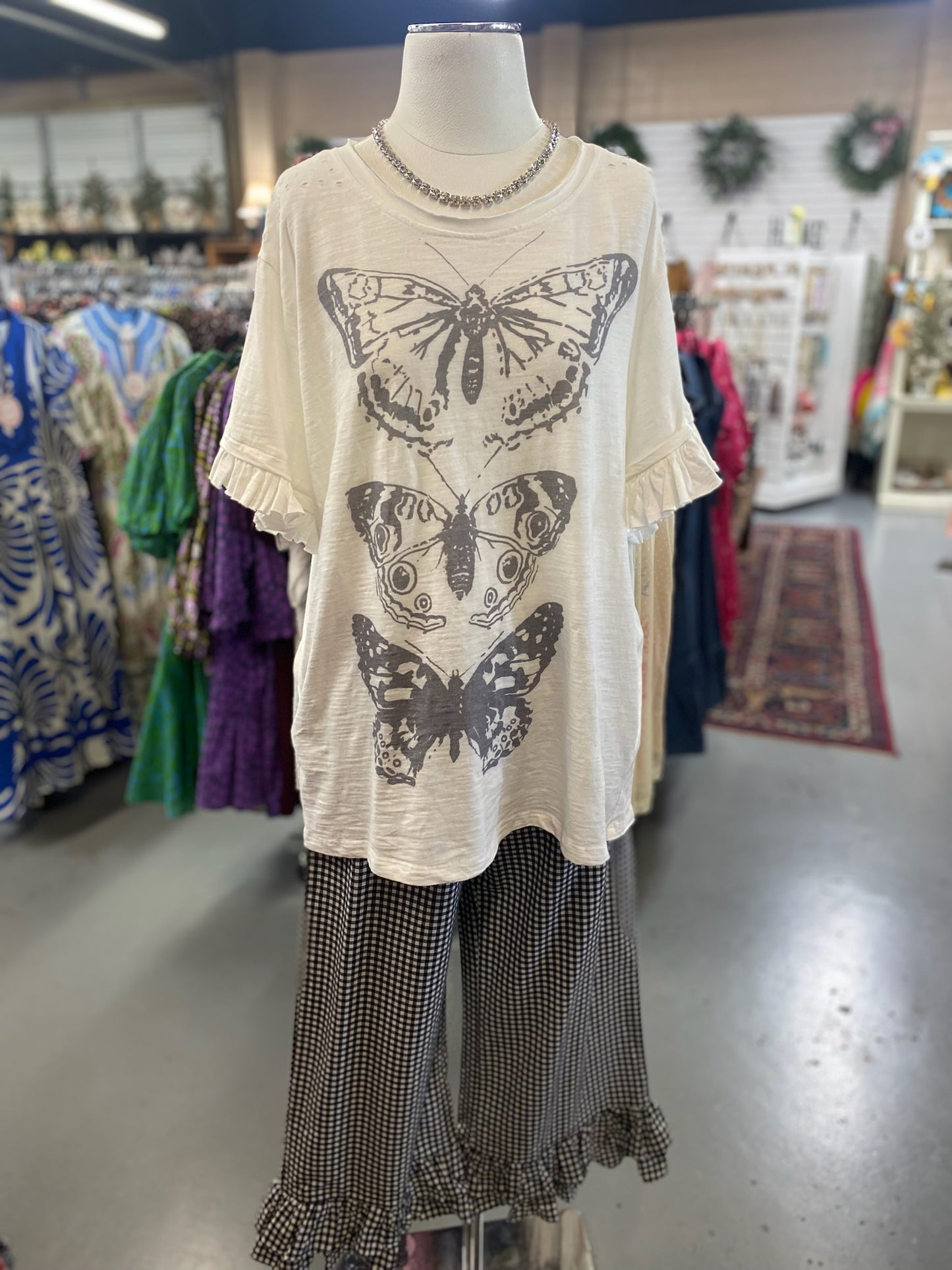 Ruffle Butterfly Top with distressing on the shoulders and pockets