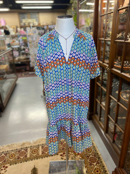 colorful chevron print midi dress with flounce hem on mannequin