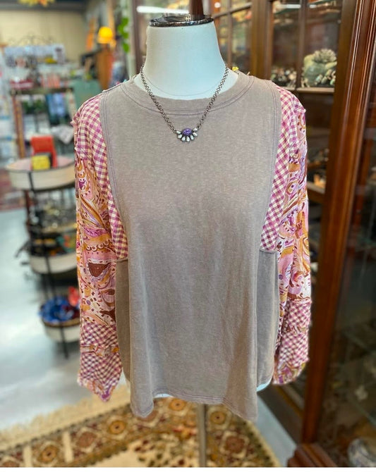 Front view of cotton mineral wash top with patterned sleeves on mannequin.