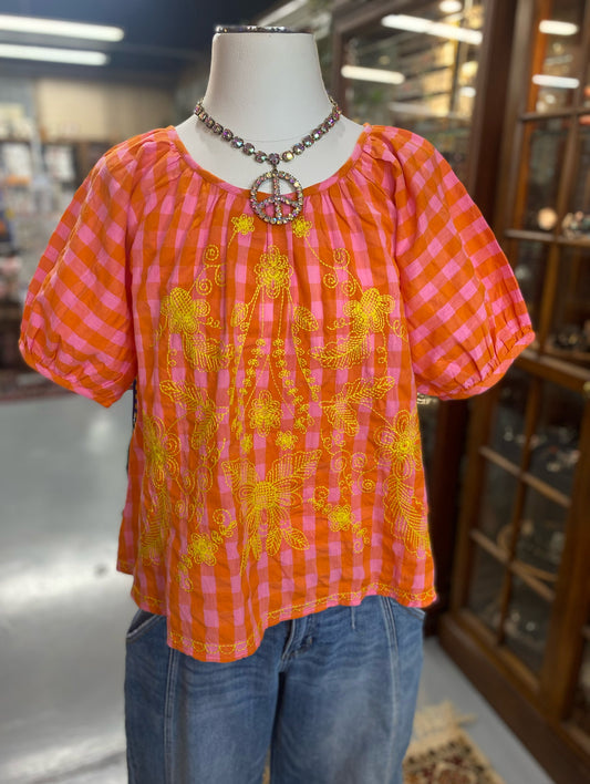 pink and orange gingham top with yellow floral embroidery
