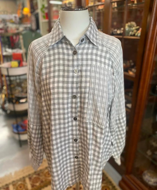 front view of gray cotton checkered button up top displayed on mannequin