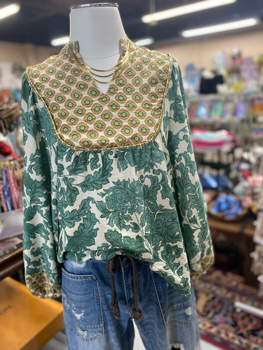 green floral top with printed yoke and drawstring hem on display mannequin