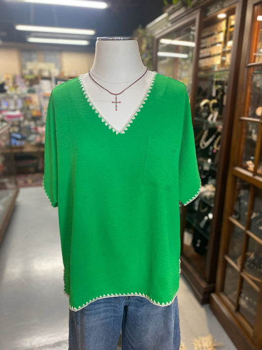 kelly green oversized top with white trim and pocket