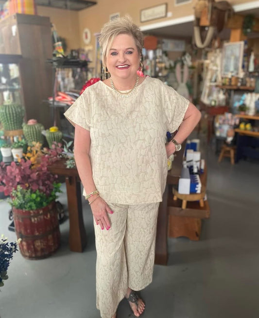 woman wearing neutral textured two-piece cotton and linen set