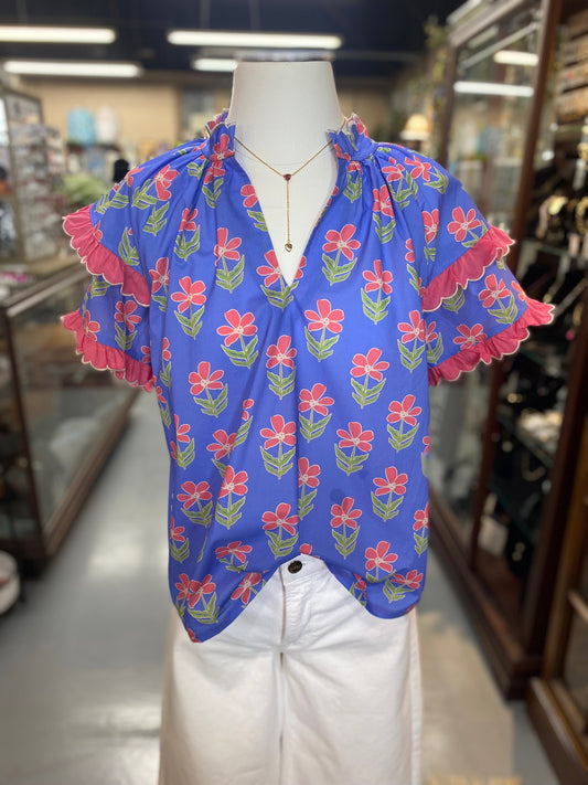 blue floral cotton top with pink ruffle sleeves and relaxed fit